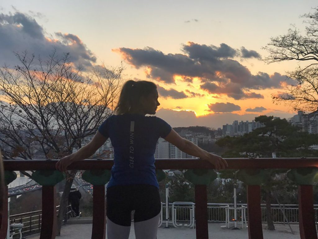Woman watching sunset from a Seoul viewpoint
