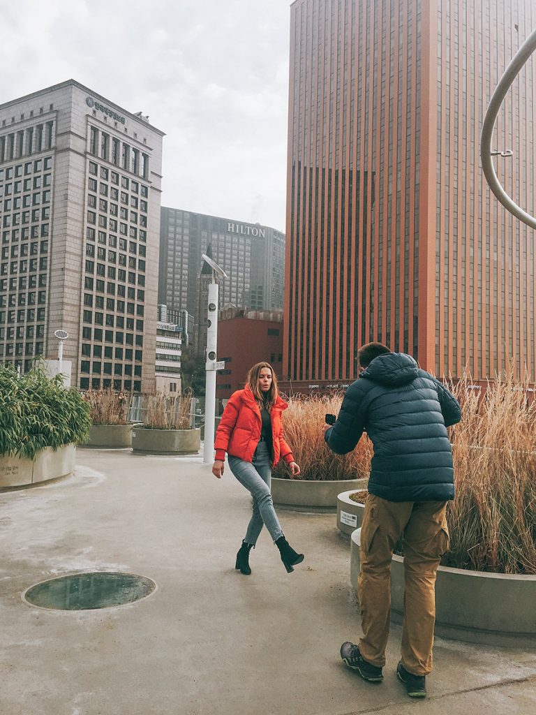Outdoor fashion shoot among Seoul office towers