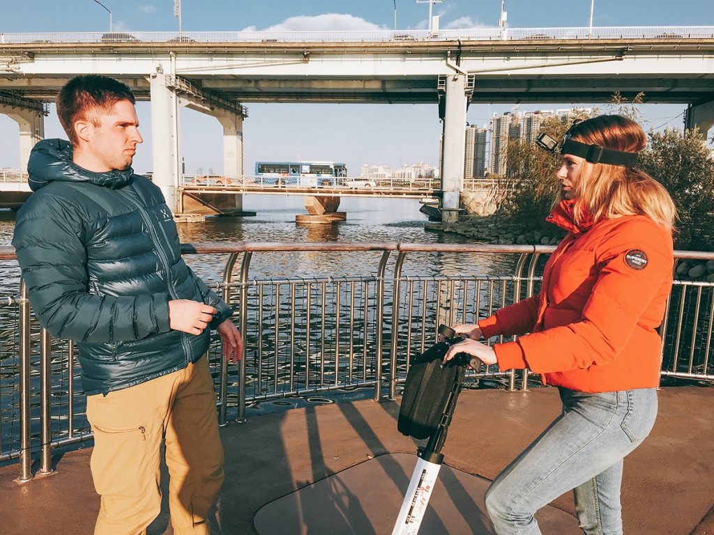 Interview being filmed beside an urban river