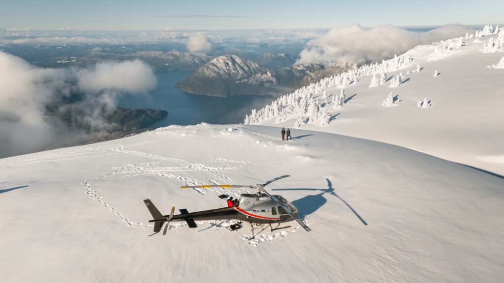 49 North helicopter on a snow-covered mountain plateau