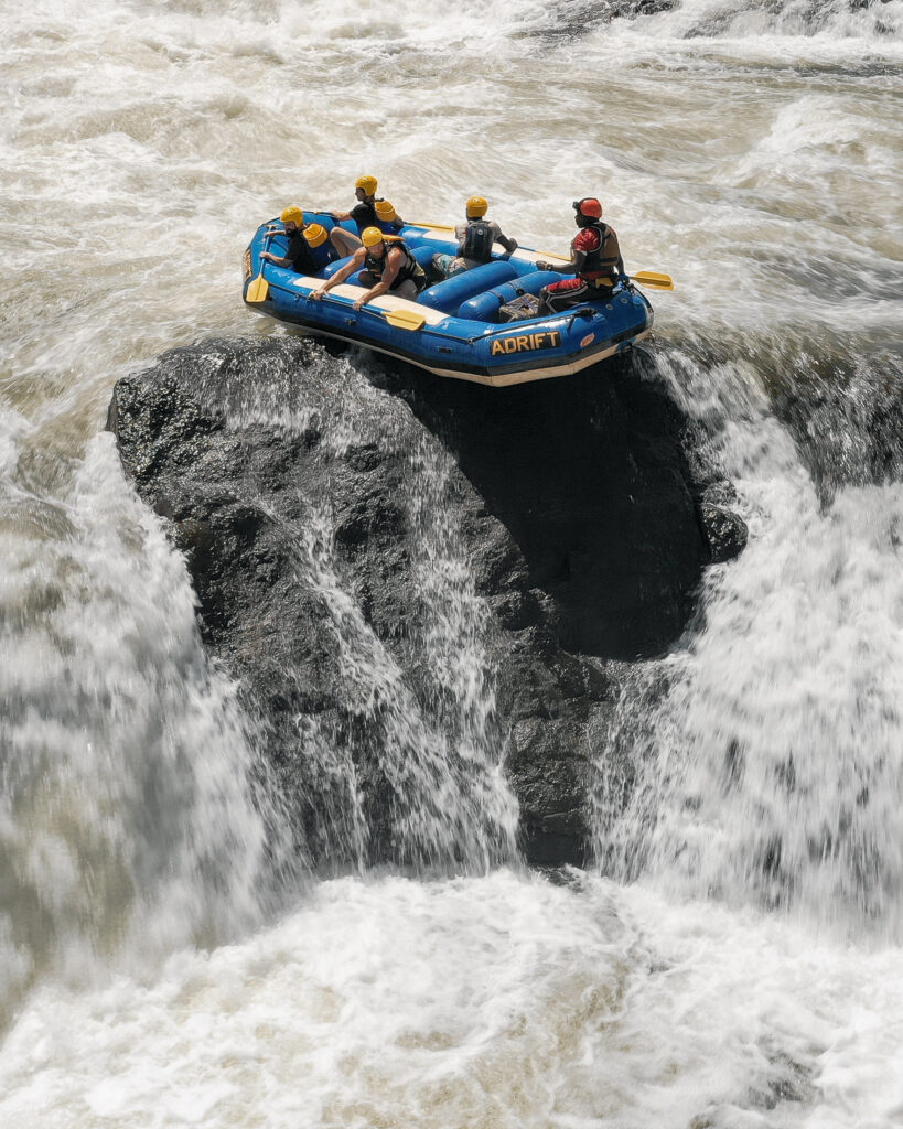 Raft crossing a steep white-water drop on the Nile near Jinja