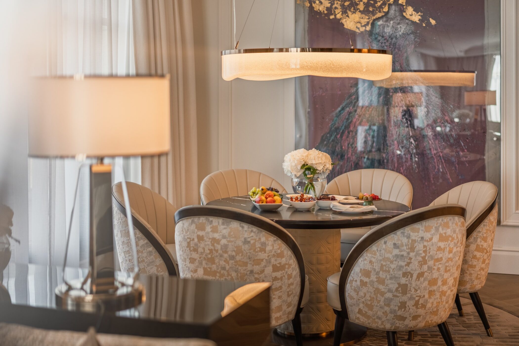 Dining table and artwork inside a Breidenbacher Hof suite
