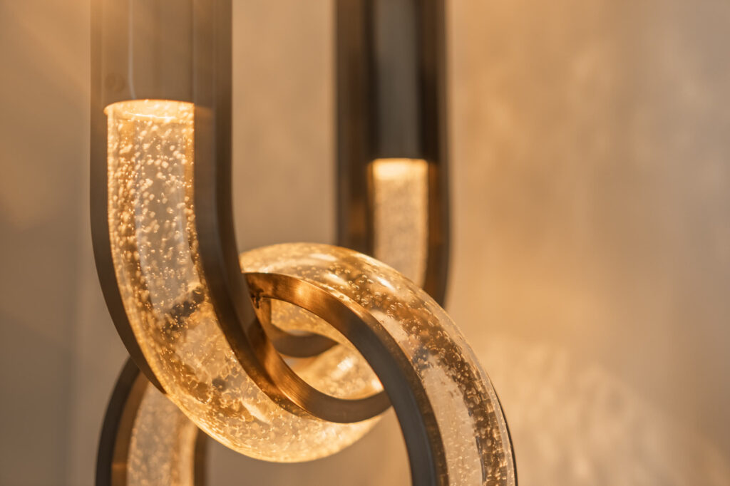 Sculptural illuminated glass and brass detail at Breidenbacher Hof Düsseldorf