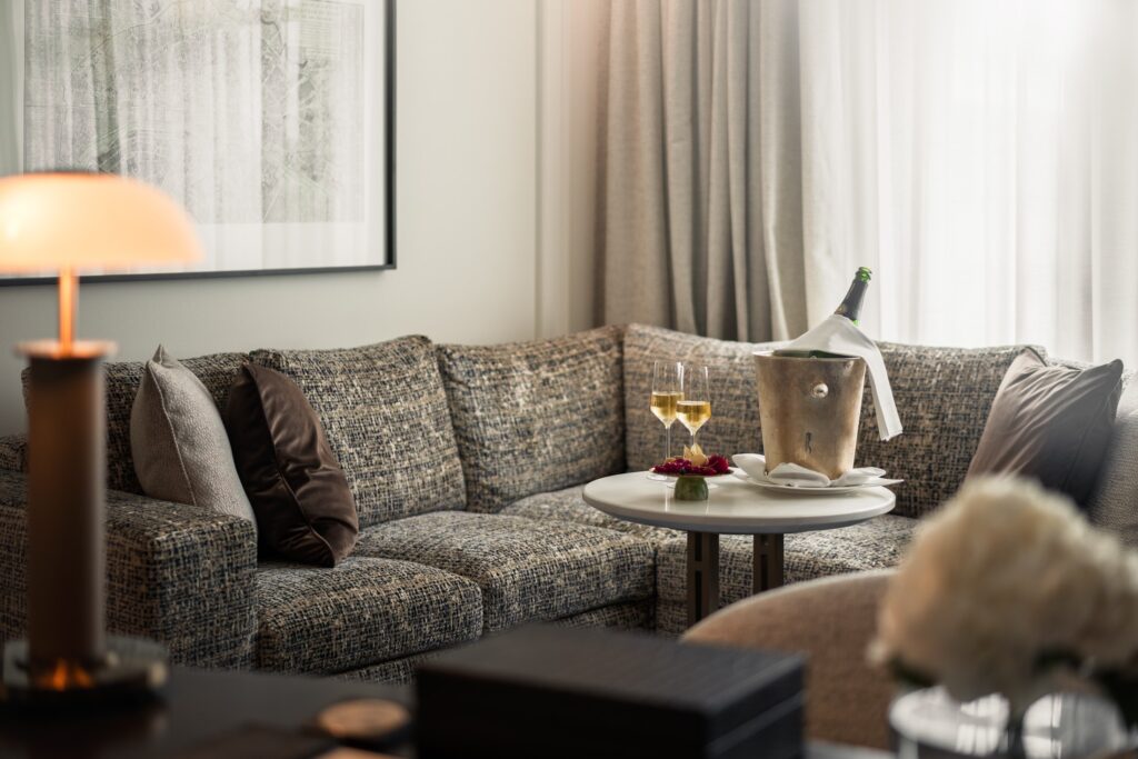 Suite living room with upholstered seating at Breidenbacher Hof