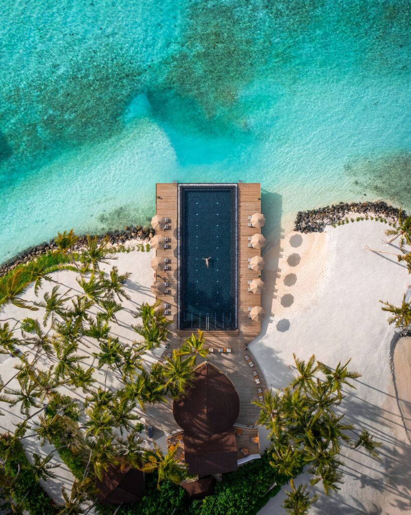 White-sand beach and clear lagoon at Olhuveli in the Maldives