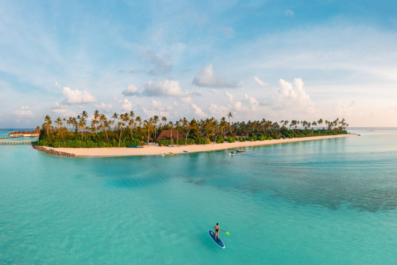 Aerial view of Olhuveli island and turquoise water in the Maldives