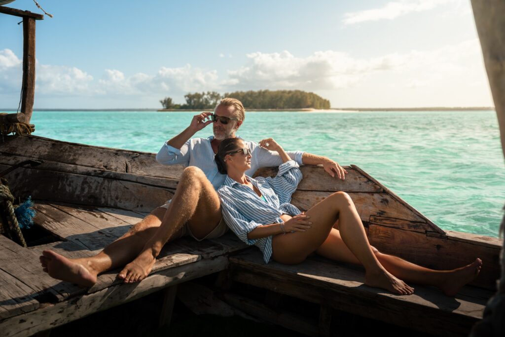 Couple sailing on a traditional dhow off Zanzibar