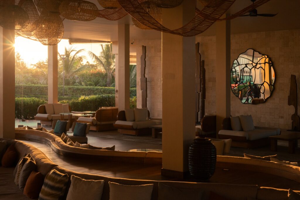 Open-air lobby at The Mora Zanzibar in warm evening light