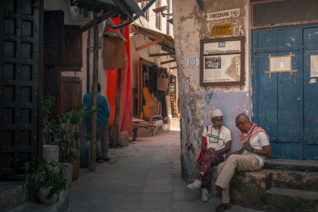 Conversation in a historic Stone Town alley in Zanzibar