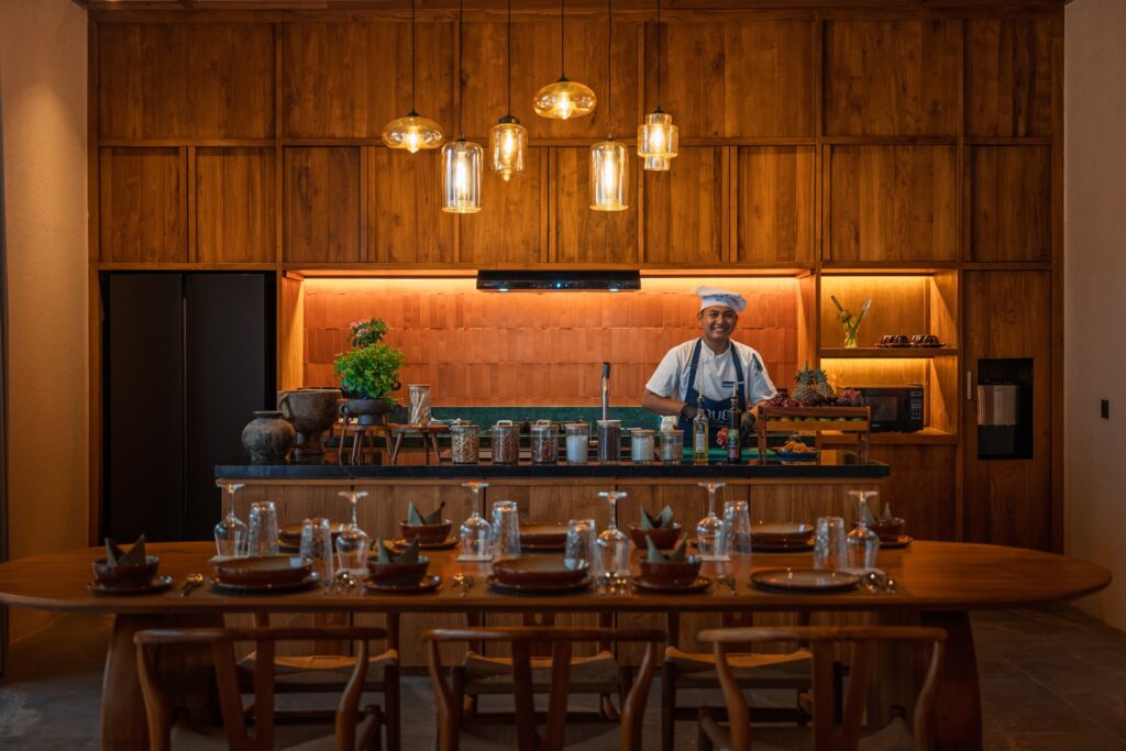 Chef working at an open restaurant counter in Bali