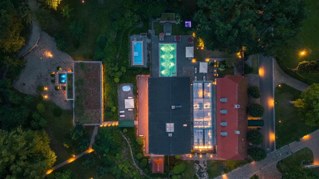 Illuminated spa setting at WEISSENHAUS resort at night